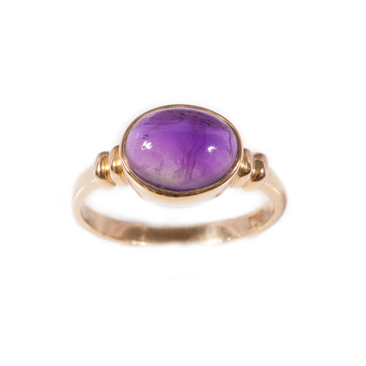 Cabachon amethyst ring set in 9ct yellow gold